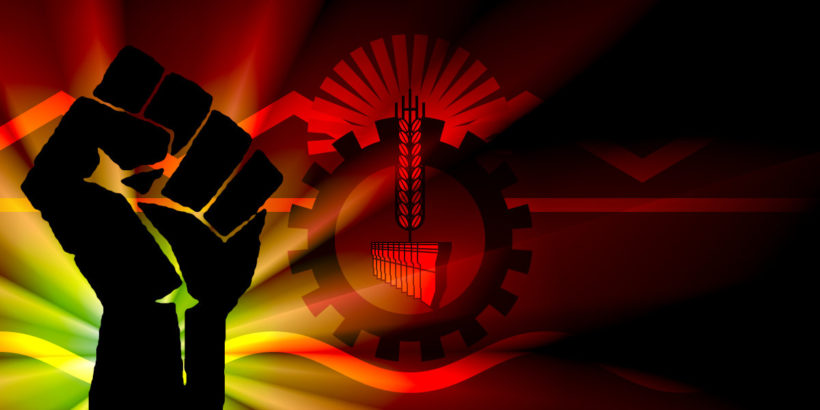 Bandera de Chubut con un puño de lucha sobre la misma, con colores rojos y amarillos.